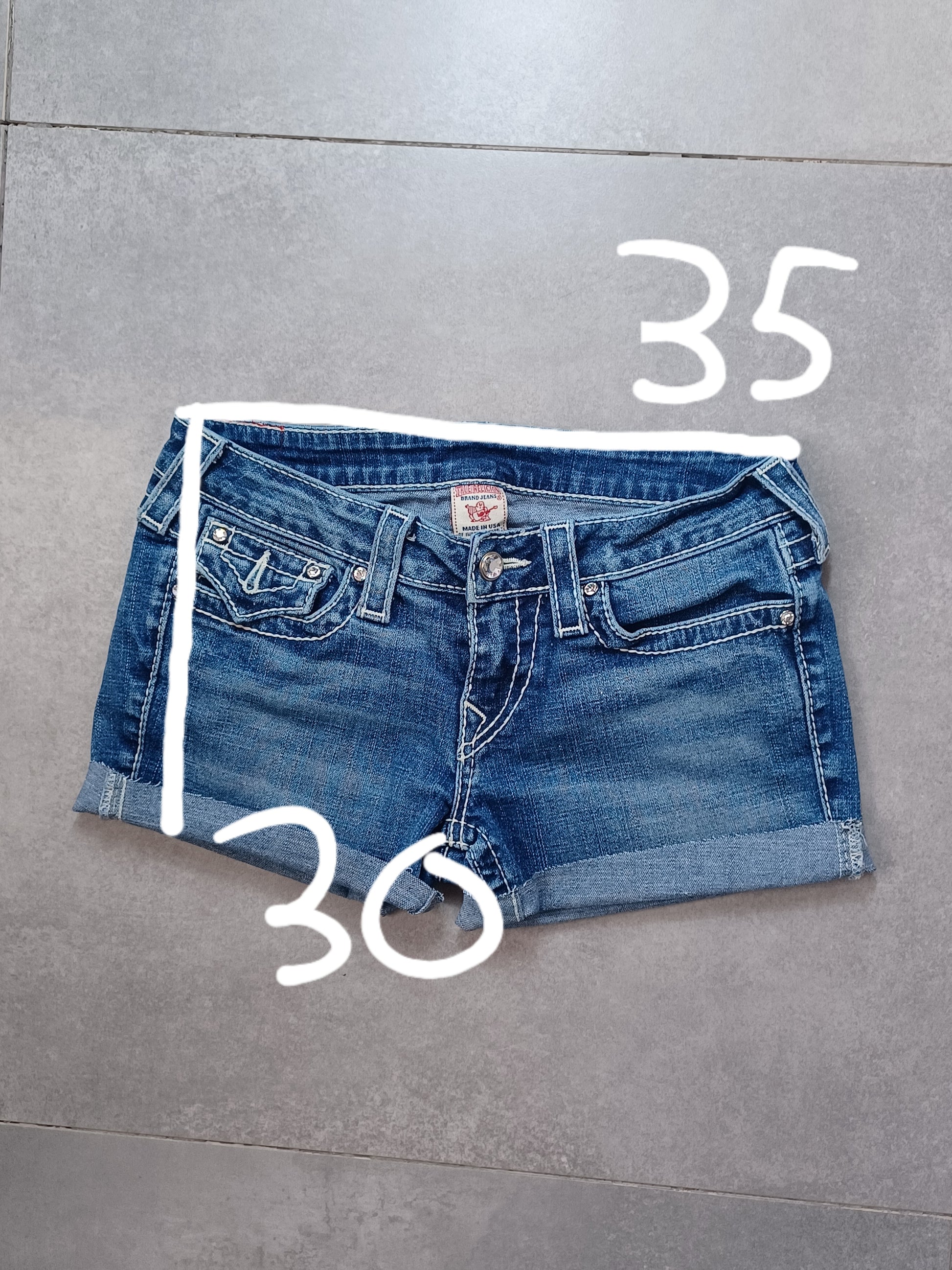 Niebieskie low rise szorty jeansowe True Religion x Swarovski